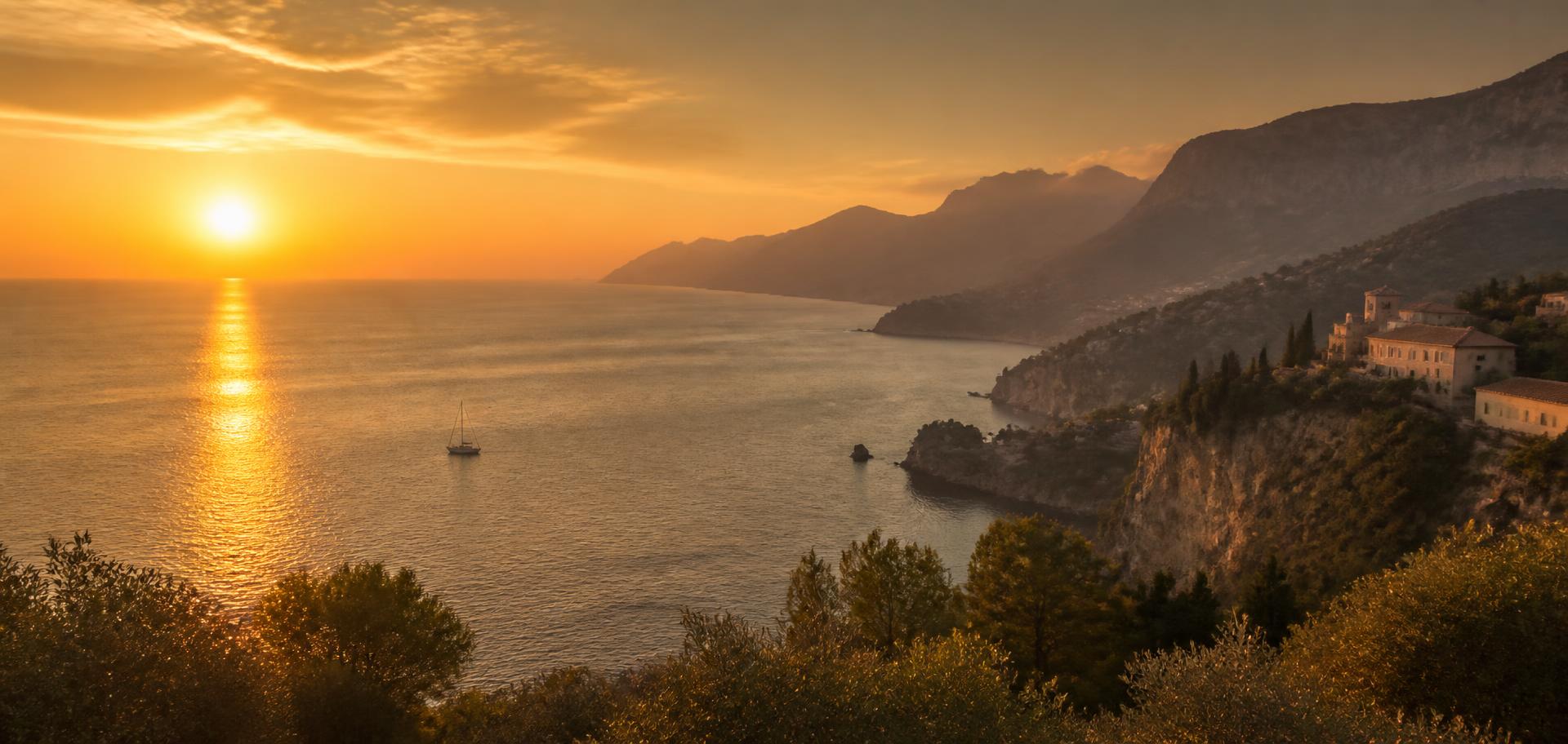 A Mediterranean coastline at sunset